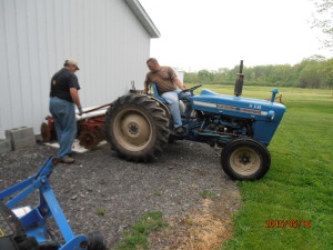 Here, the boys are attaching the disk’s to work the field up after rotortilling